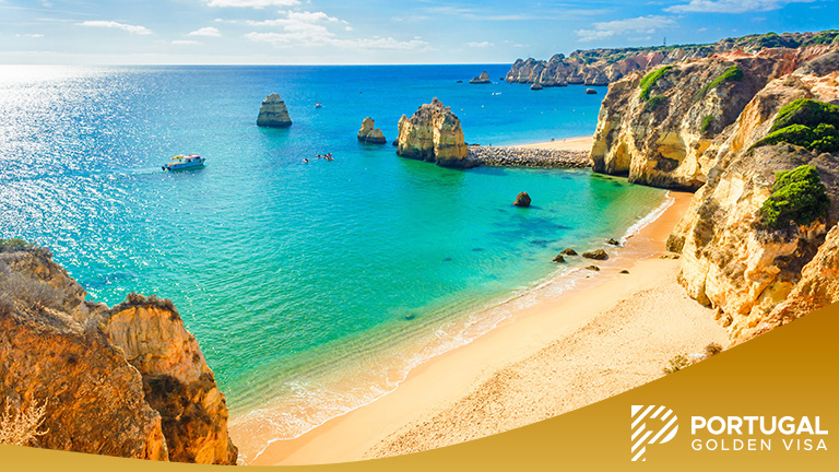 Rock cliff arches on Marinha beach and turquoise sea water on coast of Portugal in Algarve region
