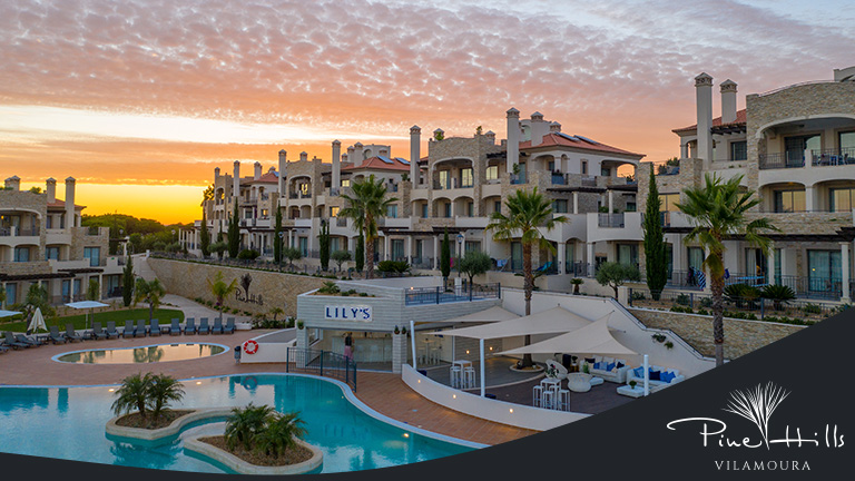 Pine Hills Vilamoura, Algarve, Portugal - aerial photo of the resort overlooking the pool and poolside bar at sunset